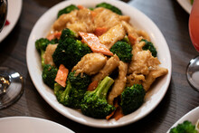 Chinese Chicken And Broccoli Plated On A Table