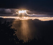 © Cavan Images - Sunlight rays burst through clouds after storm, Yosemite California