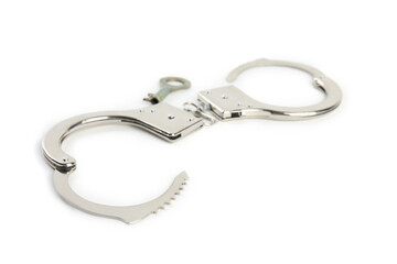 Classic chain handcuffs with key on white background