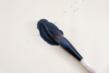 Wall Mural - A brush full of ink falls on the raw rice paper
