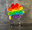 children's anti-stress toy  in a shopping cart on a dark background