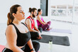 © Marcos - Plus size young hispanic woman sitting while practicing meditation during yoga session in Latin America
