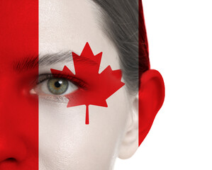 Wall Mural - Young woman with face in colors of Canadian flag on white background, closeup