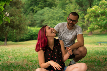 A happy young couple is spending their time together in nature.