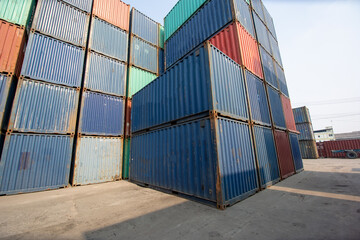 Row of Stacking Containers of Freight Import/Export Distribution Warehouse. Shipping Logistics Transport Industrial, container box in warehouse in shipping port.