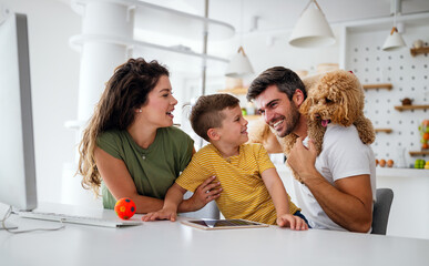 Wall Mural - Young happy family having fun, being playful at home