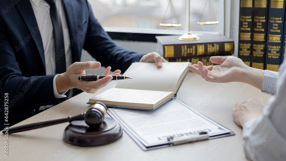 Attorney or judge provides legal advice to the client in the courtroom ...