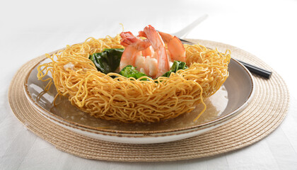 deep fried crispy yellow noodle mee with seafood big prawn and vegetable in thick gravy sauce asian menu