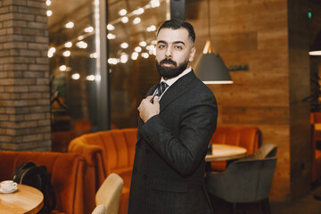 Stylish businessman in a black suit