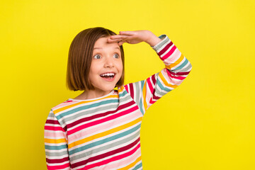 Wall Mural - Photo of cool short hairdo small girl hand head look empty space wear colorful shirt isolated on vivid yellow color background