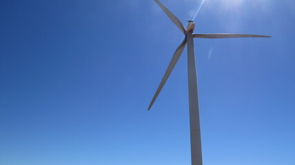 Beautiful blue sky with a windmill. 