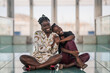 © ADDICTIVE STOCK - Relaxed black girl friends bonding and looking at camera
