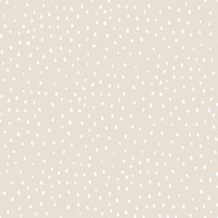 Vector abstract cute hand drawn seamless pattern with a irregular dots on a beige background. Pastel baby texture ideal for fabric, wallpaper, wrapping paper, card, layout. Delicate children's print.