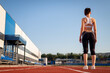 © Александр Гаврилычев - Woman getting ready to start on Stadium, summer outdoors training. Woman run training outdoors. Health and sport concept.