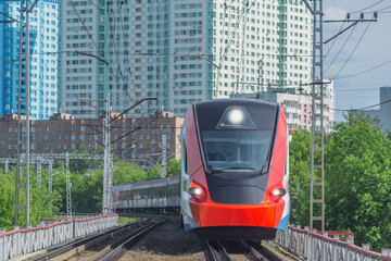 Wall Mural - Electric train moves at day time. Moscow.