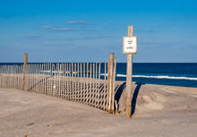 A Keep Off Sign And Fence On Fragile Sand Dunes At Assateague Island National Seashore, Maryland