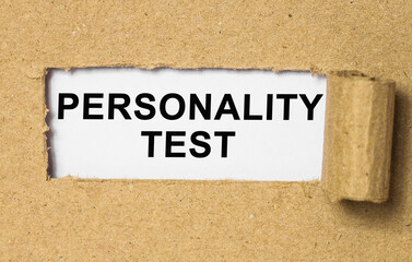 Wall Mural - The text Personality test behind torn brown paper. Business Concept image