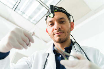 Portrait of an attractive doctor treating a patient