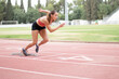 © PAVEL - young powerful woman starting to sprint