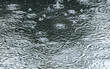 big puddle with ripples and bubbles during heavy rain