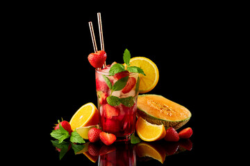 Wall Mural - Strawberry mojito with lemon and mint isolated on black background with reflection