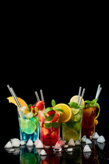 Wall Mural - Long Island Ice Tea, Mojito and Blue Lagoon Cocktails - studio shot on black background