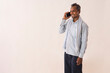 © IndiaPix - A LABOURER HAPPILY STANDING TALKING ON MOBILE PHONE