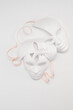 © VLAD ANTONOV - White venetian masks of different shapes and types on a background