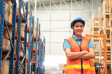 Portrait of female factory worker standing with arms crossed. Industrial and industrial workers concept. 