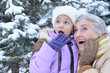 Portrait of grandmother and granddaughter in winter