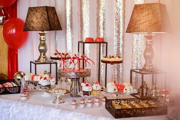 Wall Mural - Delicious sweet buffet with cupcakes. Sweet holiday buffet with cupcakes and other desserts. Candy Bar.