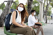 vaccinated people still wearing mask in outdoor public space as covid coronavirus variant spread