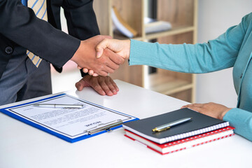 Businessperson Shaking Hand With Candidate, Job applicant having the interview manager shaking hands in a contemporary office. Human resources concept.