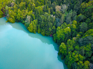 Aerial shot of congro lake with turquoise waters in Sao Miguel, Azores.