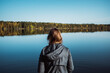 © em113 - Woman on a calm lake during autumn