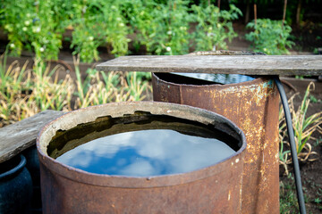 old iron barrels for water