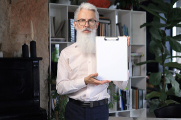 Sticker - Confident pensive mature business man in modern office.