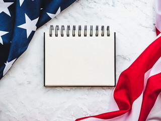 Wall Mural - American Flag lying on an empty table. Place for your inscription. Beautiful card. Closeup, view from above. National holiday concept. Congratulations for family, relatives, friends and colleagues