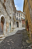 Fototapeta Przestrzenne - A small street among the old houses of Arce, a medieval village in the Lazio region in Italy.