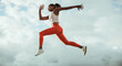 © Jacob Lund - Athletic woman running and jumping outdoors