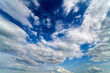 canvas print picture - Summer Blue Sky and white cloud white background. Beautiful clear cloudy in sunlight calm season. Panoramic vivid cyan cloudscape in nature environment. Outdoor horizon skyline with spring sunshine.