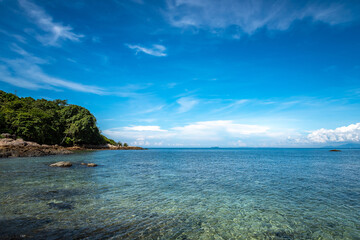 Nature in twilight period which including of sunrise over the sea and the nice beach. Summer beach with blue water and purple sky at the sunset.	
