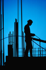 Poster - Real construction worker working on a high building.