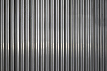Background From Unpainted Corrugated Metal. Vertical Stripes.