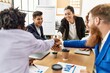 © Krakenimages.com - Group of business workers smiling happy celebrating with hands together at the office.