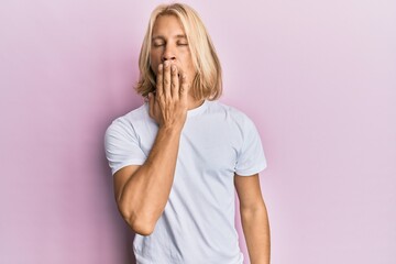 Sticker - Caucasian young man with long hair wearing casual white t shirt bored yawning tired covering mouth with hand. restless and sleepiness.