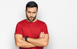© Krakenimages.com - Young hispanic man wearing casual clothes skeptic and nervous, disapproving expression on face with crossed arms. negative person.