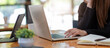 © wichayada - young businesswomen looking through online ideas with computer. Business adviser analyzing financial figures denoting the progress in the work of the company