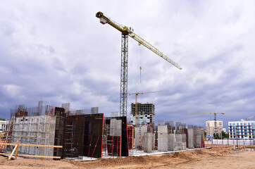 Сonstruction site with foundation pit for monolithic reinforced skyscraper. Monolithic slab foundation and concrete pouring. First floor slab rebar installation. Floodwork under the slab foundation