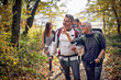 © luckybusiness - An elderly couple at hiking exploring beautiful sight